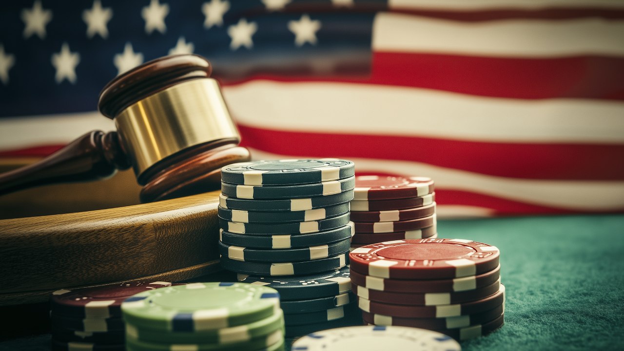 An image of casino chips and a gavel with the American flag in the background.